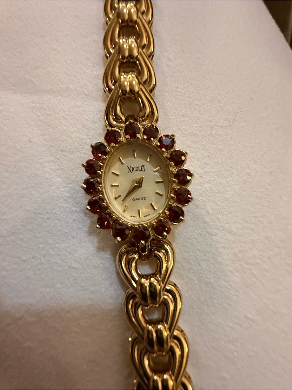 NicoleT Gold-Tone Bracelet Watch with Garnet Stone Halo